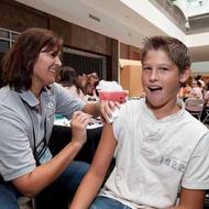 Teenaged boy getting a vaccine