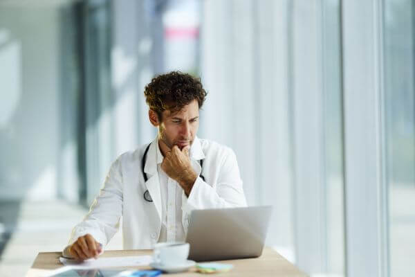 Doctor Working on Computer 600 Doctor Working on Computer 600