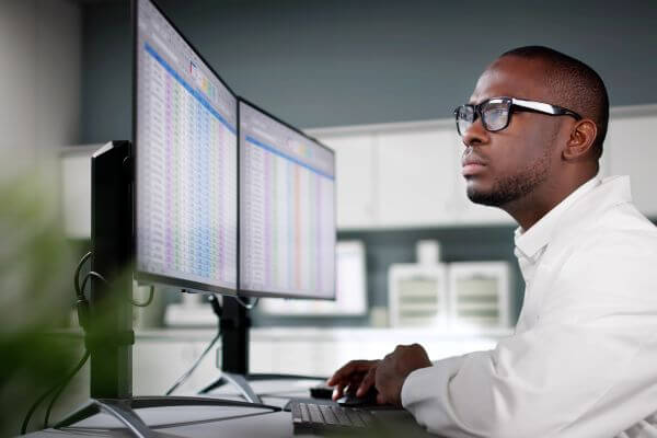 Doctor working on computer sq