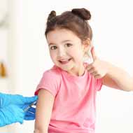 Young girl giving a thumbs up
